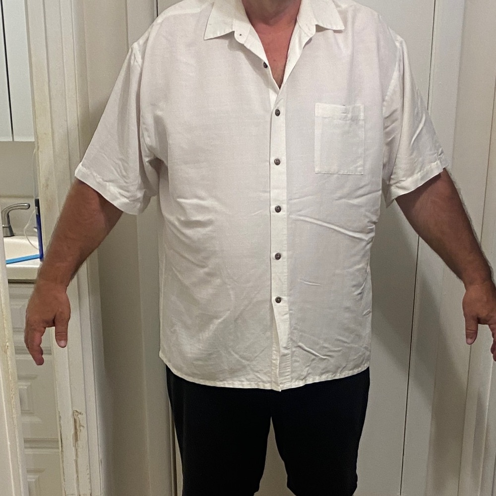 Three mens XXL button down shirts. Excellent condition. One shirt Tommy Bahama.